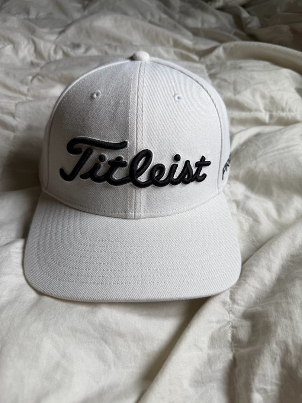 Titleist White Cap with Black Script and Red Border Patch 7 & 3/4